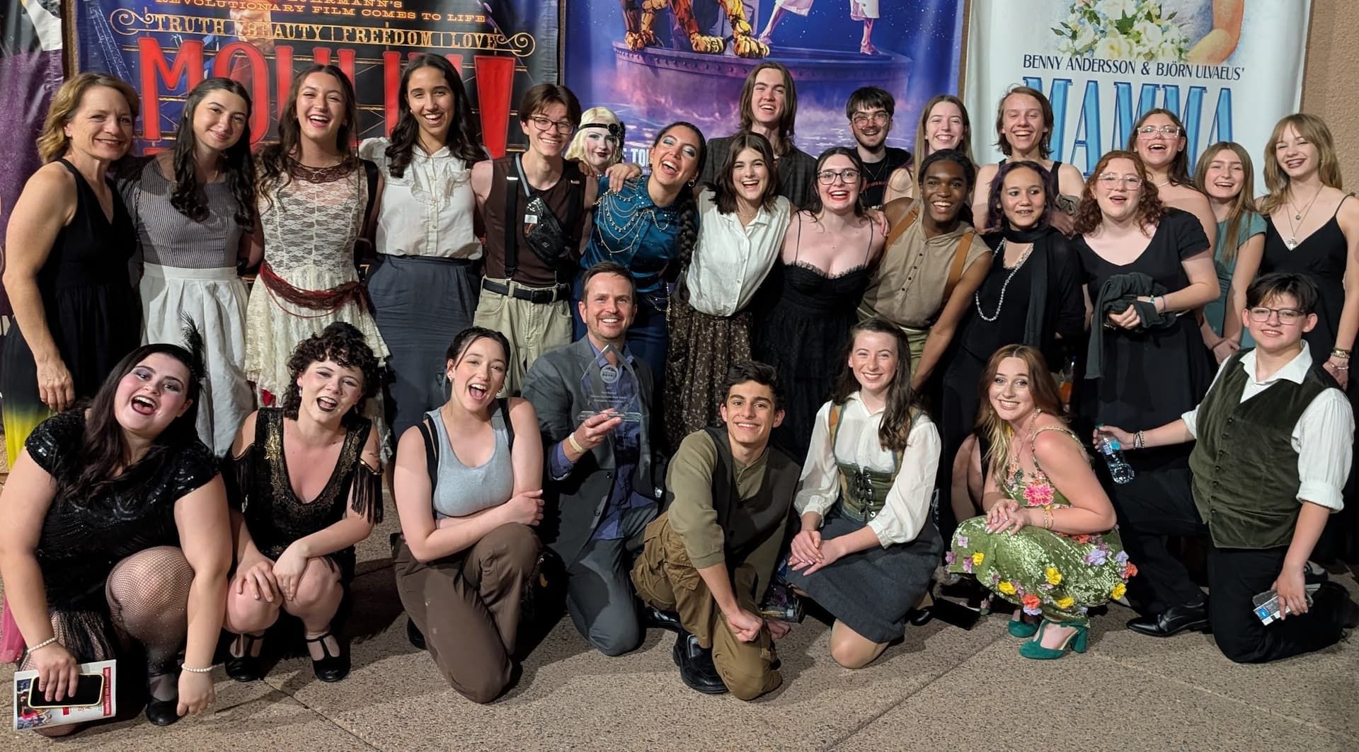 NVAA cast and director holding the Best Musical trophy at the ASU Gammage awards